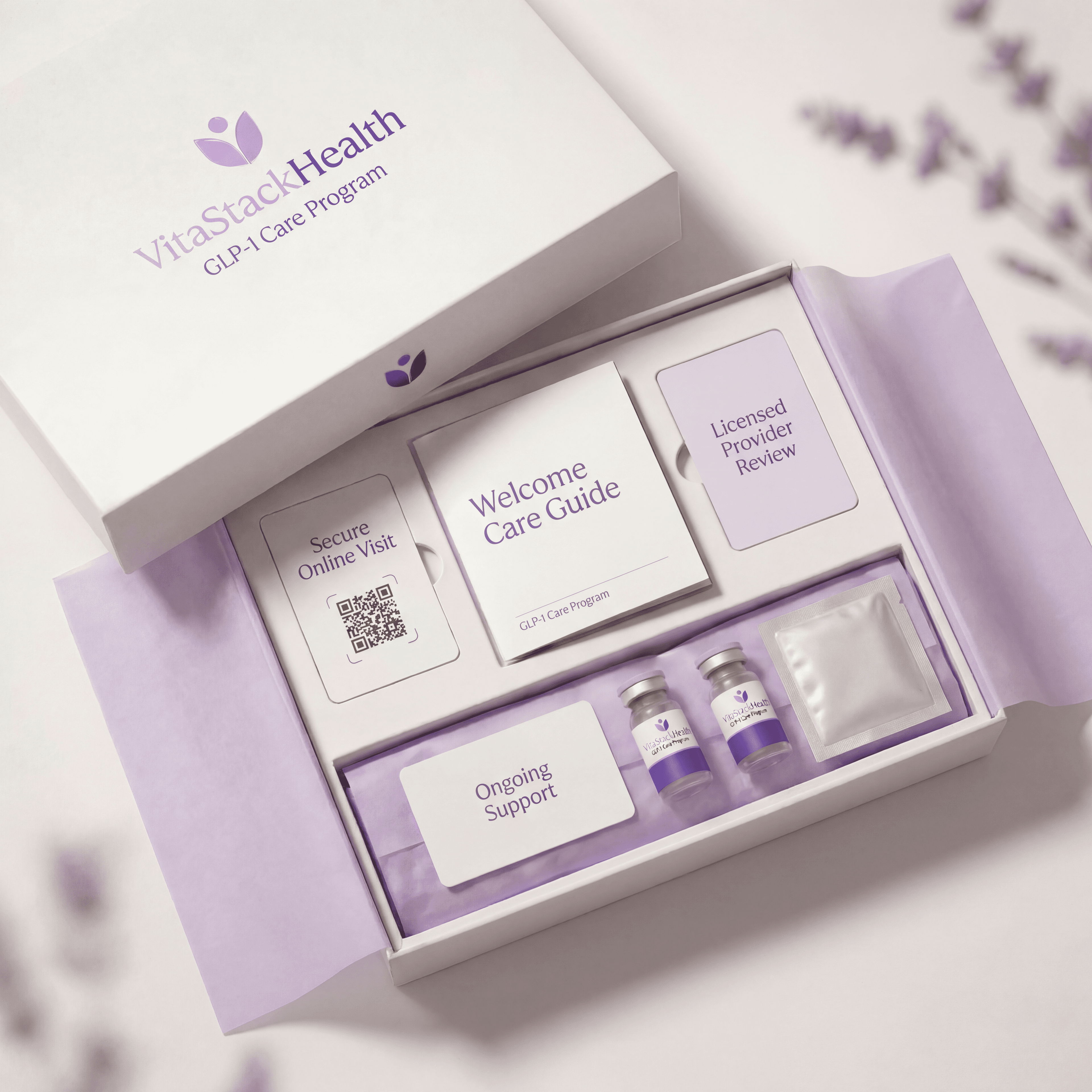 VitaStack Health GLP-1 Care Program kit — welcome guide, provider review card, and medication vials